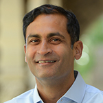 Headshot of Saumitra Jha. 