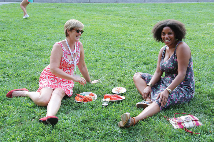 Image of two Center affiliates at the orientation BBQ
