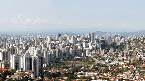 Vista of a city with a mountain backdrop.