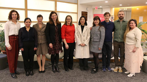 SCANCOR affiliates stand side by side in an office lobby.