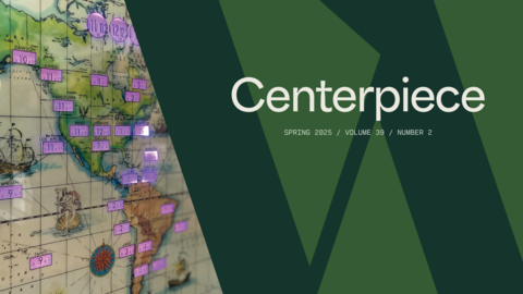 Graphic of a large dark green W overlaid onto a lighter green background with the words "Centerpiece" and issue number, alongside a close-up of a world clock.