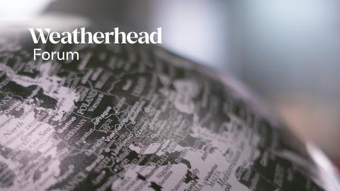 Close-up of a black and white globe with the words "Weatherhead Forum" in white.