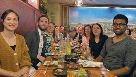 Weatherhead Scholars Program affiliates pose at a restaurant table