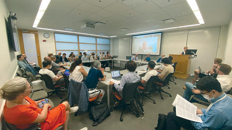 Audience listens to the climate change research cluster panel at the Center's orientation