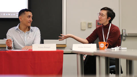 Alisha Holland provides feedback for undergraduate Victor Rangell at the Undergraduate Thesis Conference.
