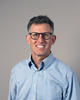 Headshot of author Joshua Busby