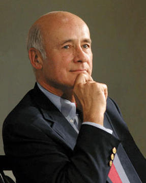 Headshot of Joe Nye, holding his chin in his hand.