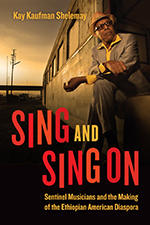 Book cover for Sing and Sing On against photo of Ethiopian man in hat and suit sitting on the side of a train at sunset