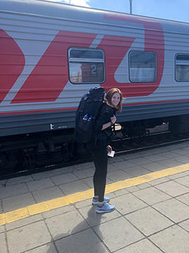 Image of Sierra Nota with her backpack on ready to board train