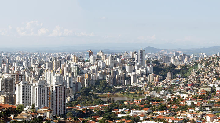 Vista of a city with a mountain backdrop.