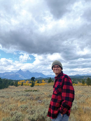 Andrew Mammel enjoying the view of the mountains on the family farm