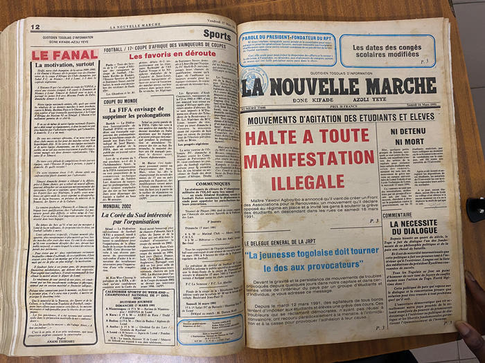 Newspaper opened to a page that says 