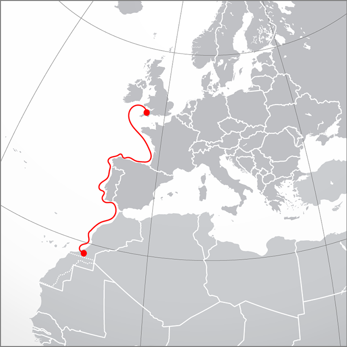 Map showing a red line tracing a route hugging the eastern Atlantic Ocean from Morocco to the UK.