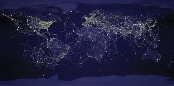 Graphic of a world map at night with connected lights in major cities