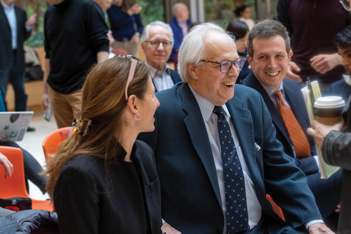Melani Cammett, laughing with the Manshels before Gina McCarthy begins speaking.