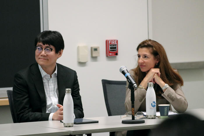 Melani Cammett and Yuhua Wang sit on a panel discussion in the Bowie-Vernon room at the Weatherhead Center