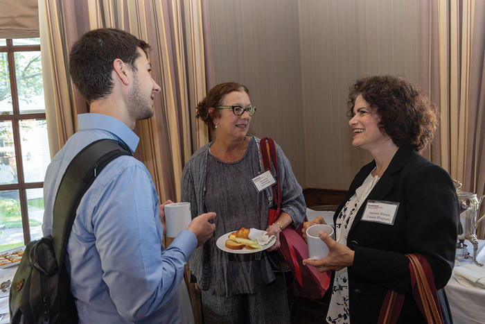 Three Canada Program affiliates chat over breakfast at orientation.