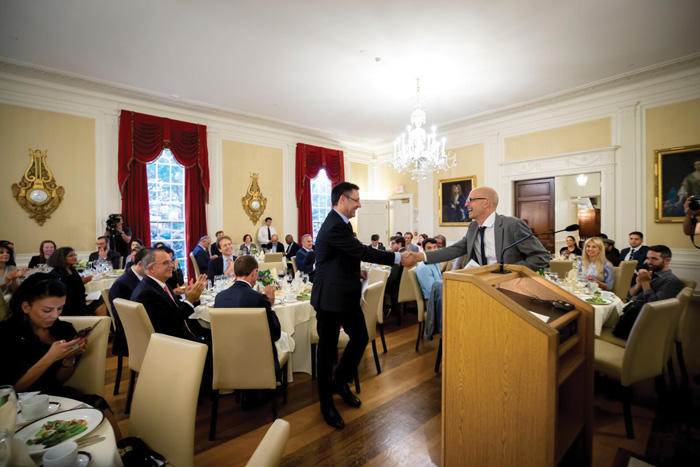 Image of keynote speaker at soccer conference in June 2018