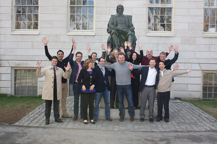 The 2015 affiliates of the Fellows Program have fun posing in front of the John Harvard statue at the quad on Harvard's campus