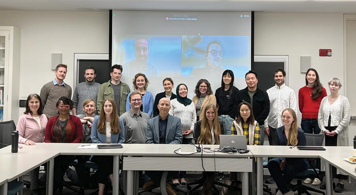 Group shot of Graduate Student Associates and staff seated around the table in the Bowie Vernon Room.