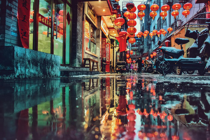 Image of a rainy reflected alleyway in Beijing, China