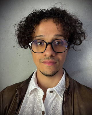 Headshot of Livio Silva-Muller.
