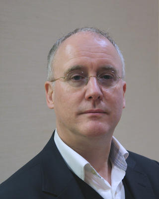 Headshot of David Armitage.