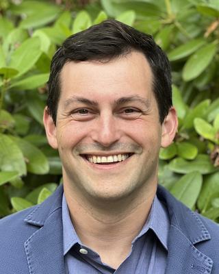 Headshot of Marc Aidinoff.