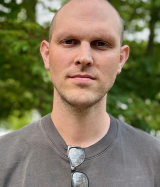 Headshot of Samuel Donahue.
