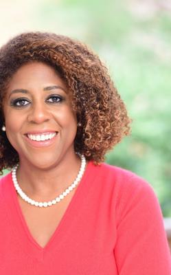 Headshot of Tjada D'Oyen McKenna.