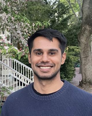 Headshot of Adil Ahsan.