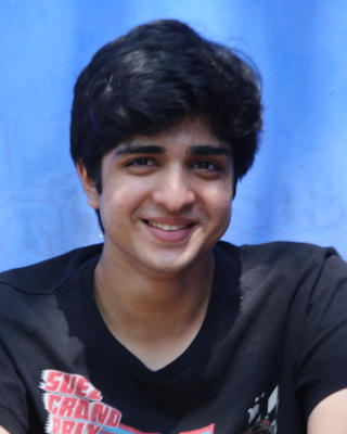 Headshot of Aran Sonnad-Joshi.