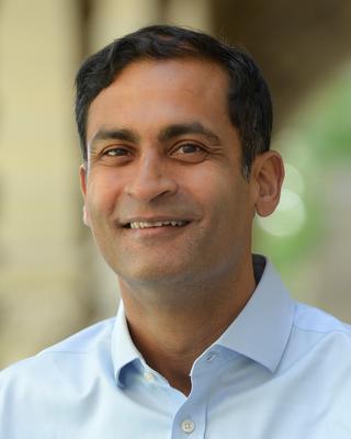 Headshot of Saumitra Jha. 