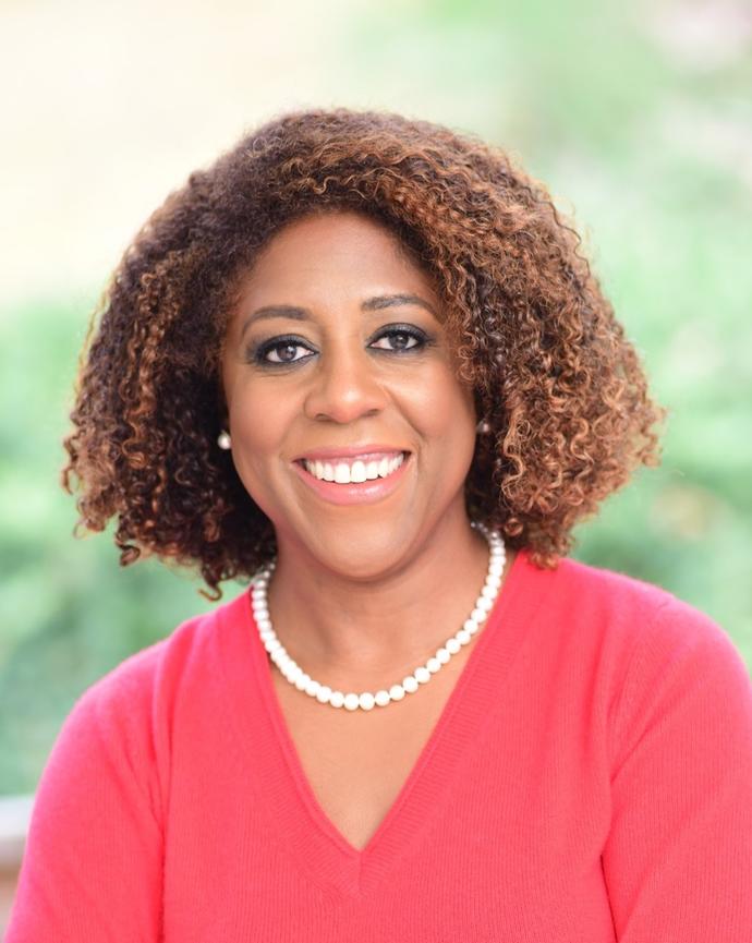 Headshot of Tjada D'Oyen McKenna.