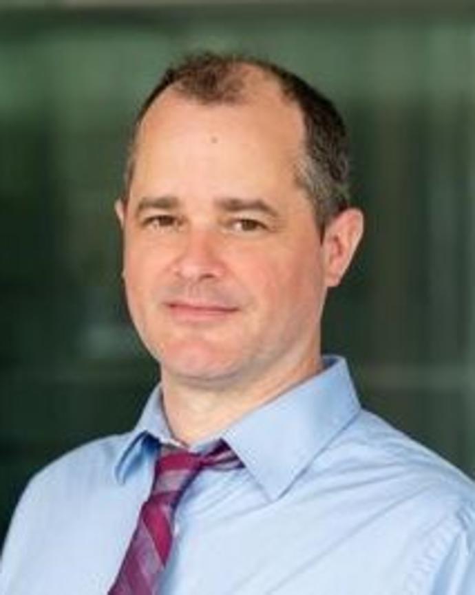 Headshot of Dustin Tingley. 