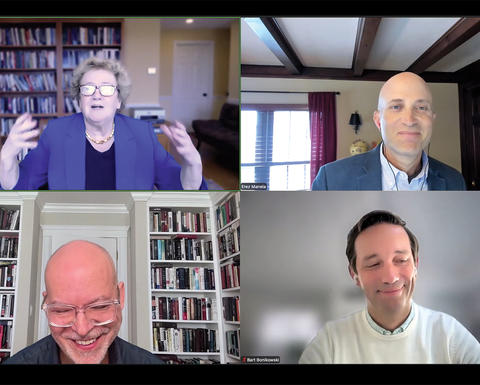 Screenshot of a virtual meeting with four people in separate video call windows, each seated indoors with bookshelves in the background.