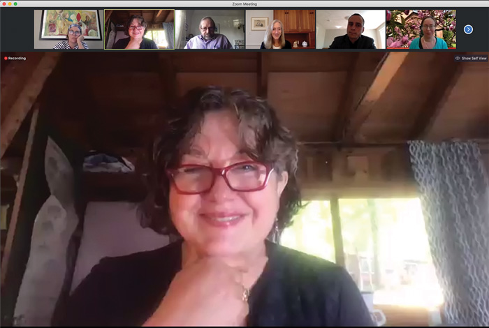 Zoom screenshot of Center Director Michele Lamont smiling as she moderates panel at the Weatherhead Forum, with six affiliates in the gallery bar at the top