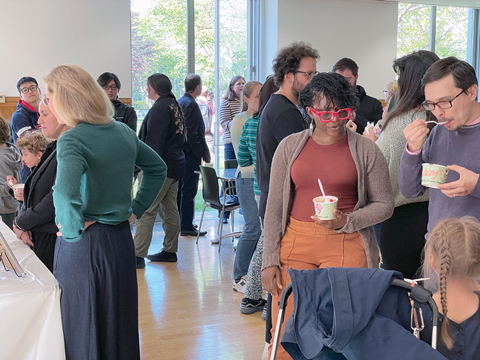 People milling around at the Fisher Family Commons ice cream social.