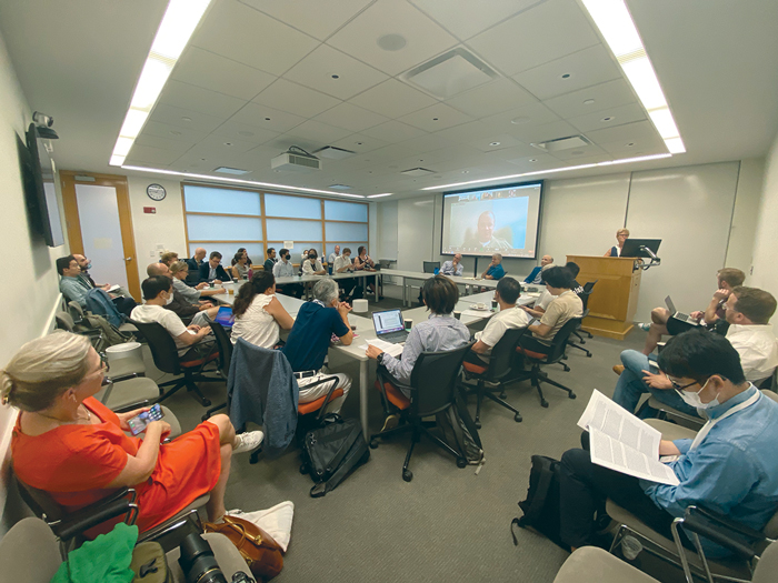 Audience listens to the climate change research cluster panel at the Center's orientation