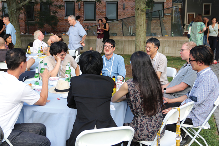 Affiliates of the Program on U.S.-Japan Relations enjoy lobster rolls at the Center's orientation BBQ